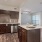 a kitchen with wooden cabinets
