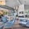 a clubhouse room with a bar and chairs