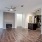 a large living room with a wood floor