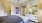 a bedroom with a bed and a mirror