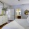 a bedroom with a large mirror