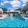 a swimming pool with a house in the background