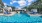 a swimming pool with a house in the background