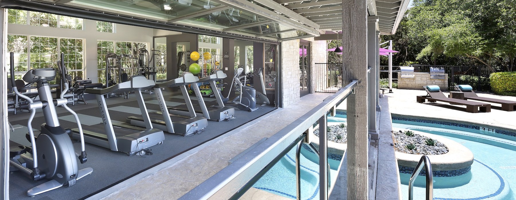 a gym next to a pool