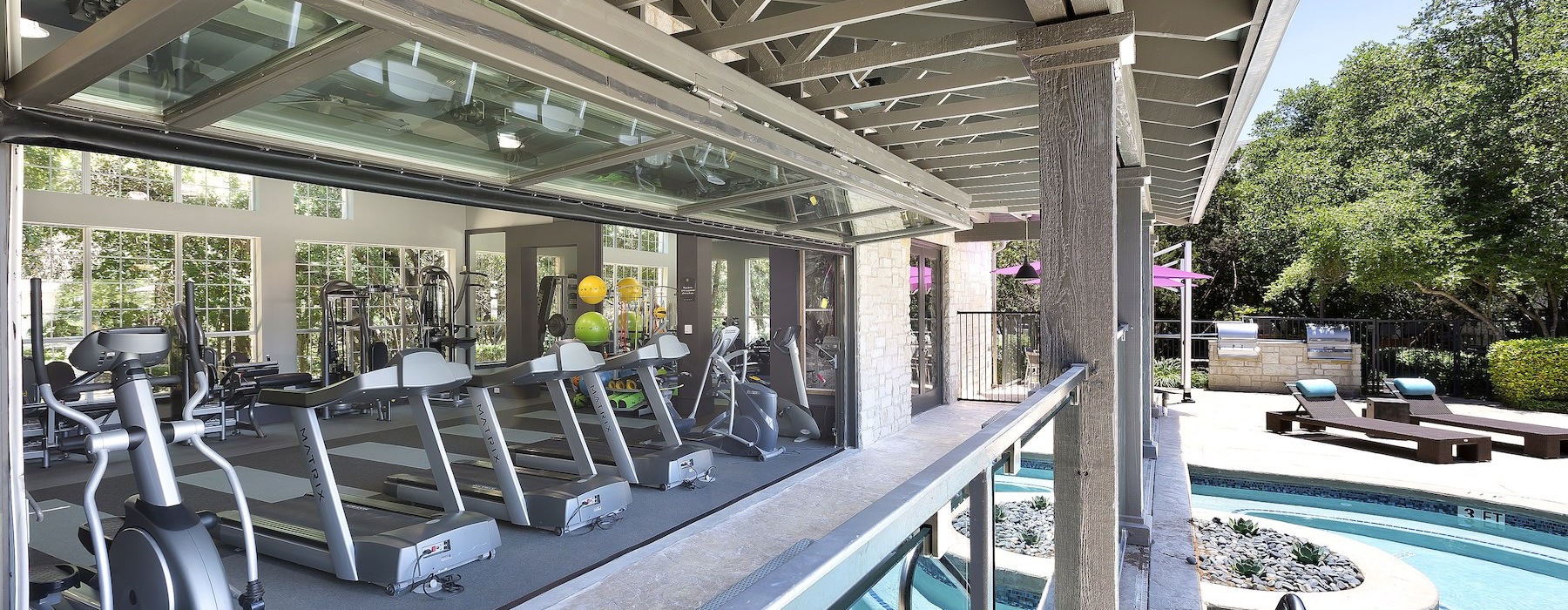 a gym next to a pool