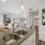 A kitchen with sink overlooking the living room space