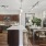 A Kitchen With Stainless Steel Appliances and dining room table