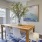 a dining room with a table and chairs